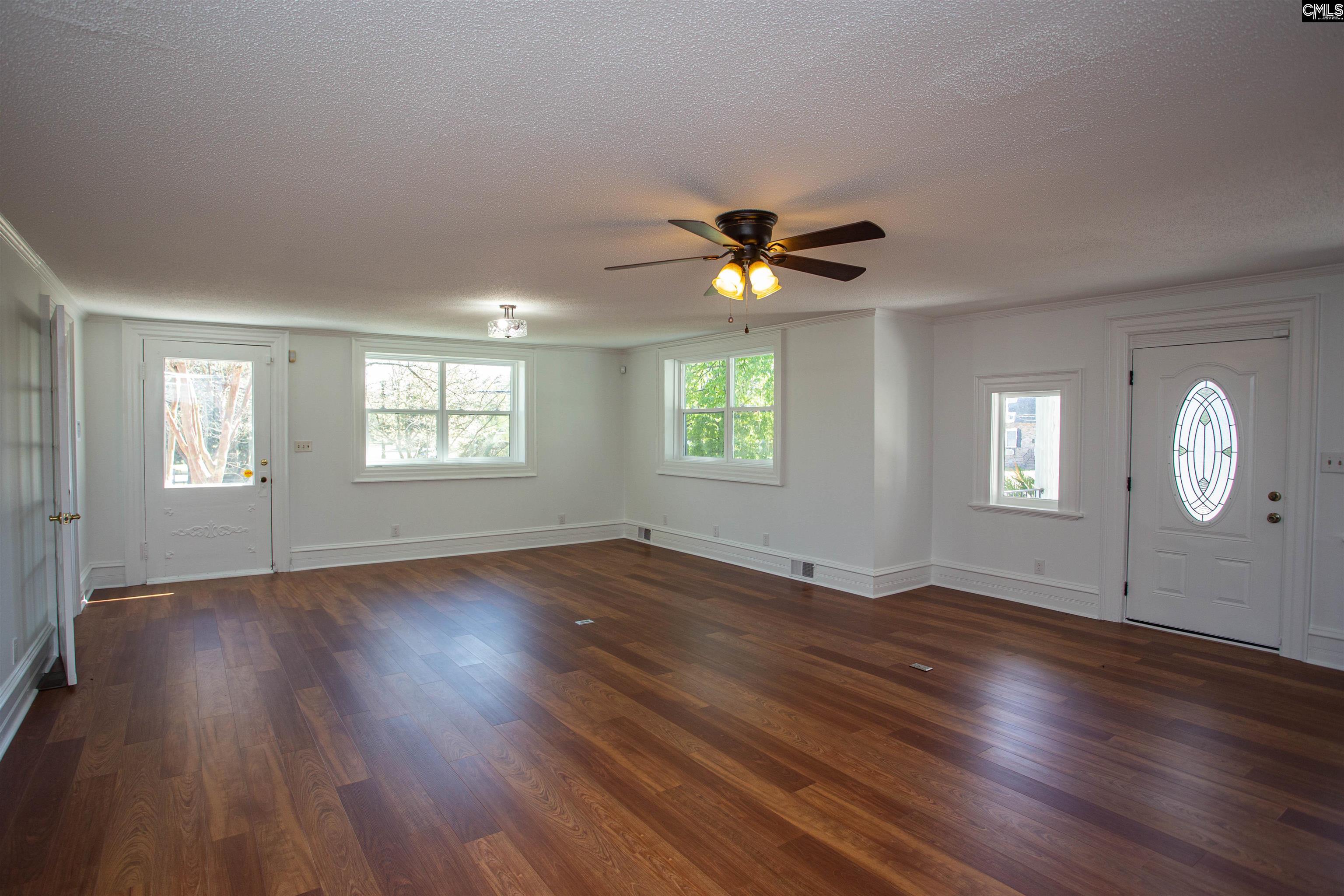 1700 Broad Street Camden, SC 29020 - Photo 3 of 41 an empty room with wooden floor and windows