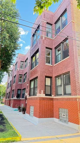 a front view of a multi story residential apartment building
