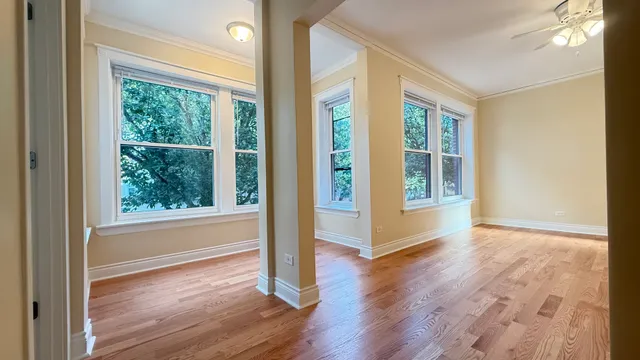 a view of a room with wooden floor and walls