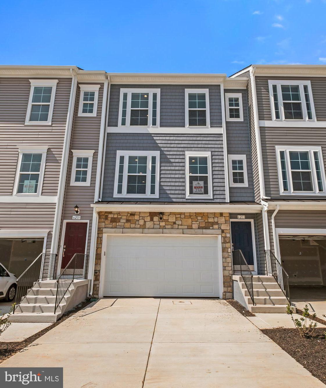 a front view of a building with many windows