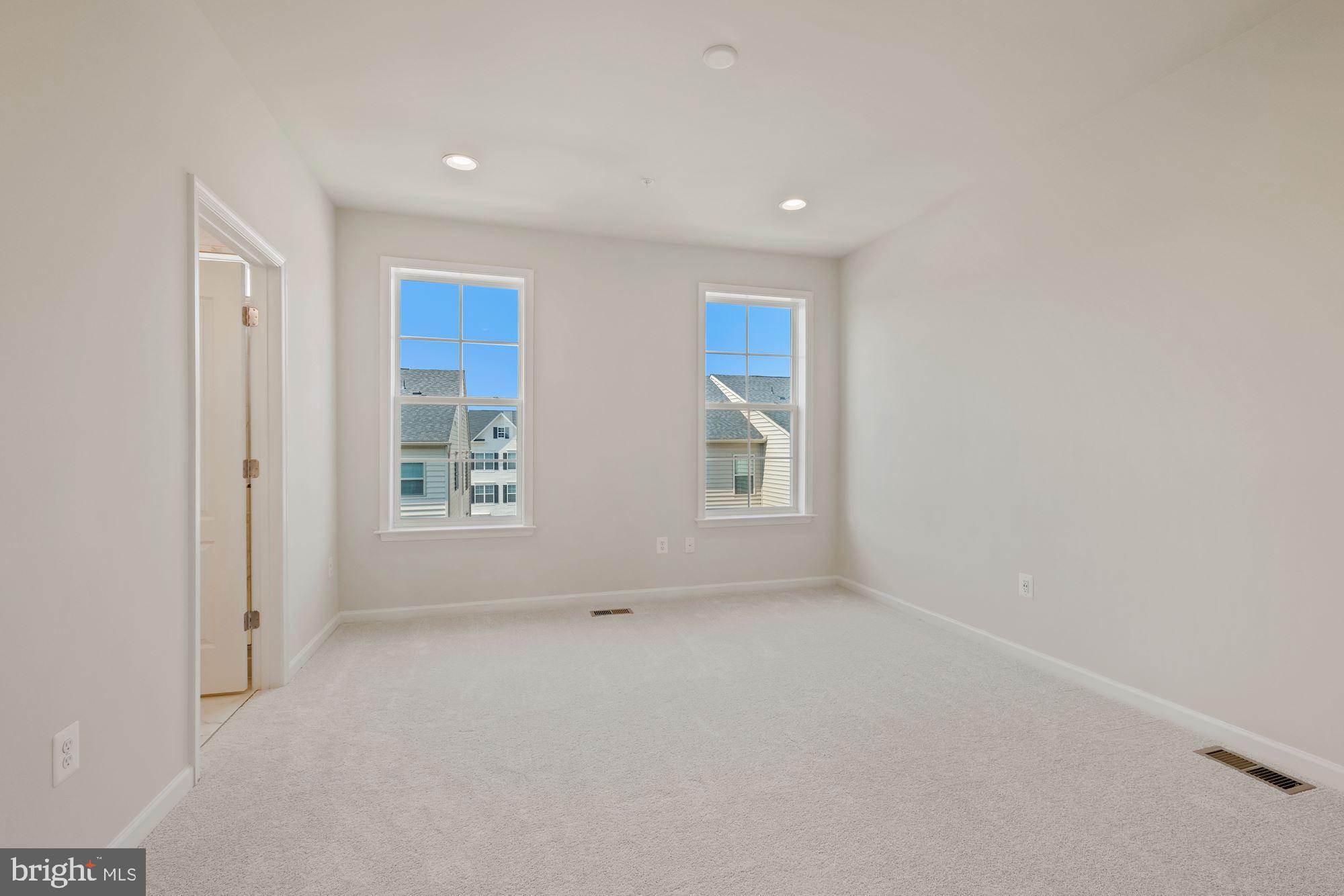 6211 Davinci Street Frederick, MD 21703 - Photo 17 of 30 an empty room with windows