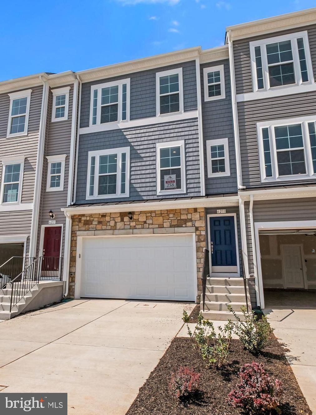 6211 Davinci Street Frederick, MD 21703 - Photo 2 of 30 a front view of a house with a yard