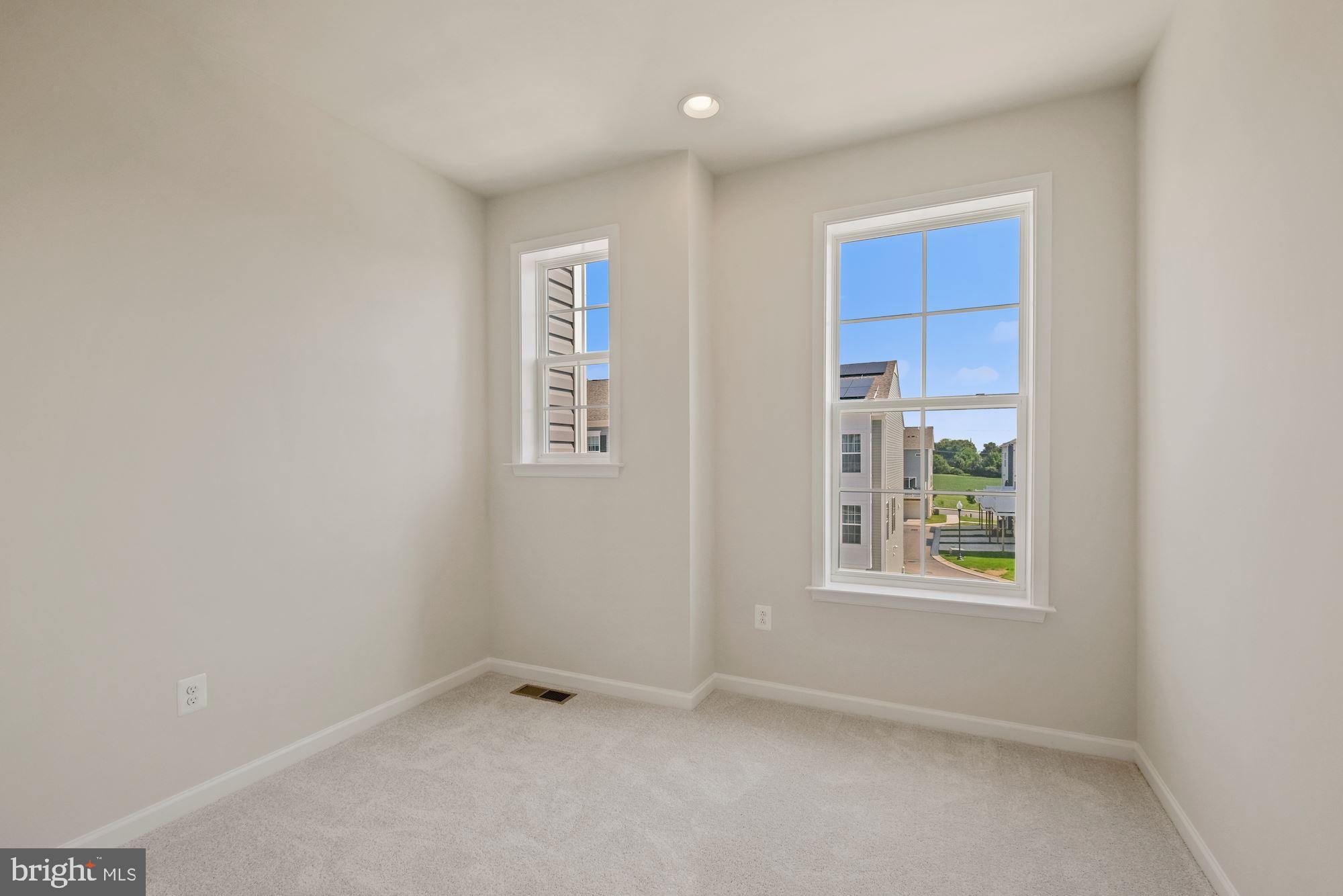 6211 Davinci Street Frederick, MD 21703 - Photo 22 of 30 an empty room with windows