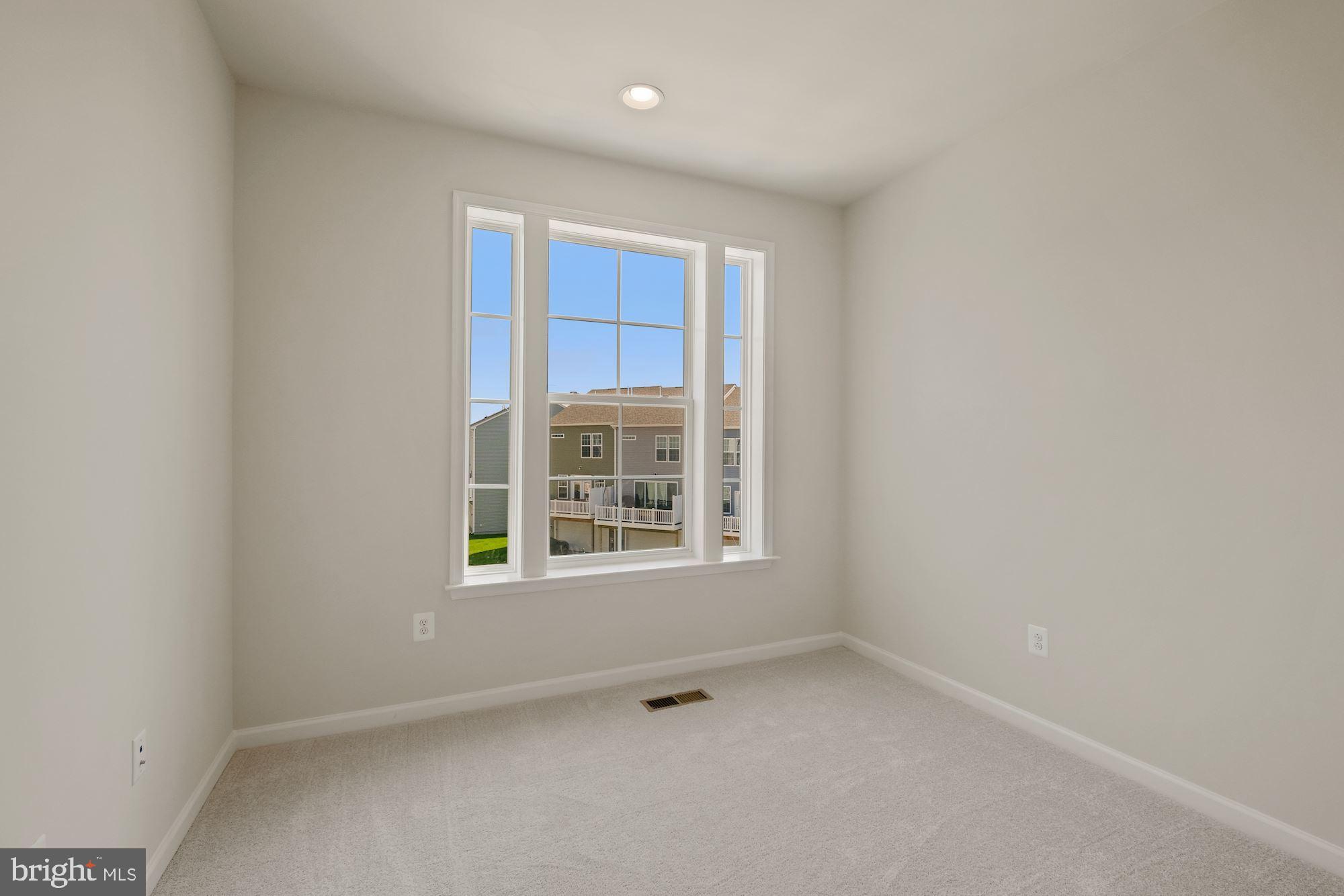 6211 Davinci Street Frederick, MD 21703 - Photo 25 of 30 an empty room with a window