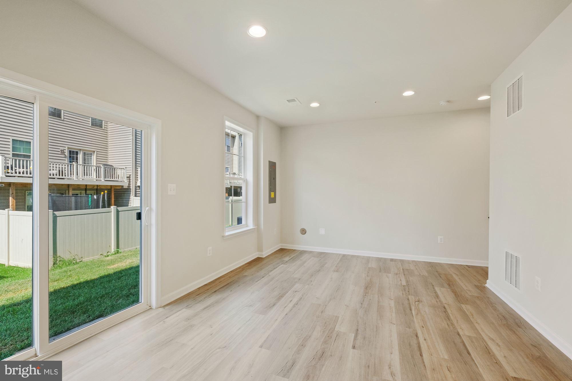 6211 Davinci Street Frederick, MD 21703 - Photo 28 of 30 a view of wooden floor and windows in a room