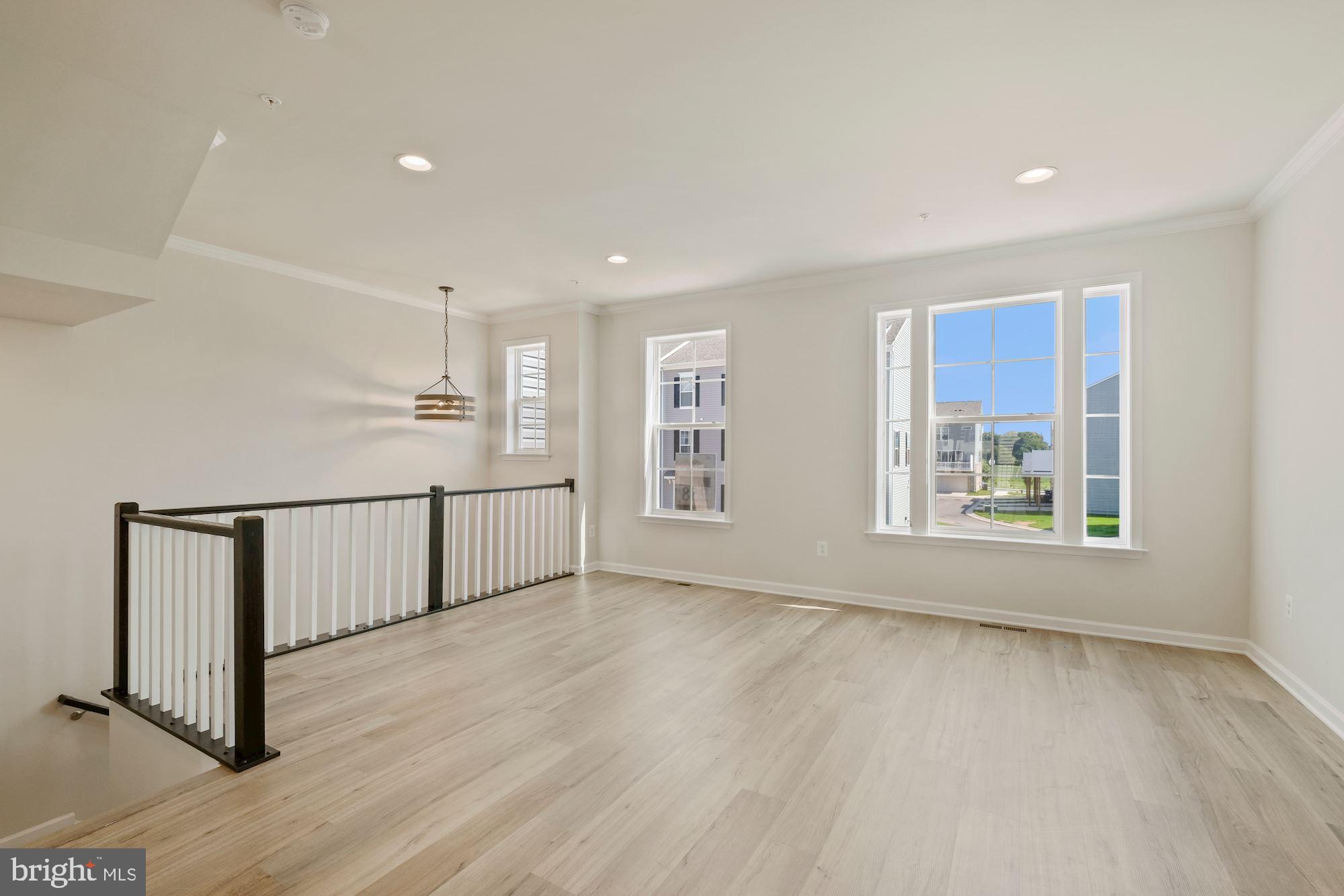 6211 Davinci Street Frederick, MD 21703 - Photo 6 of 30 a view of an empty room with a window
