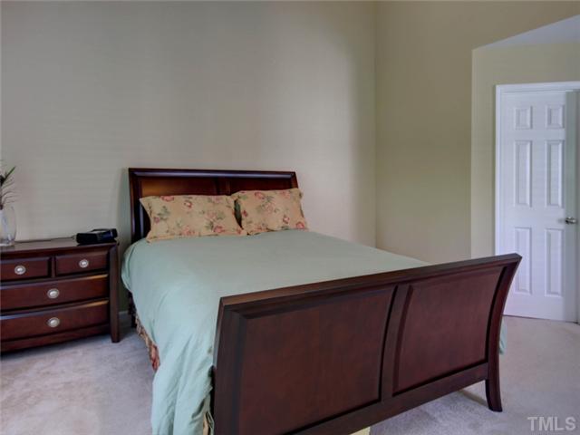 8434 Central Drive Raleigh, NC 27613 - Photo 11 of 25 a bedroom with a bed and a dresser