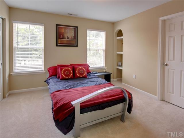8434 Central Drive Raleigh, NC 27613 - Photo 14 of 25 a bedroom with a bed and window