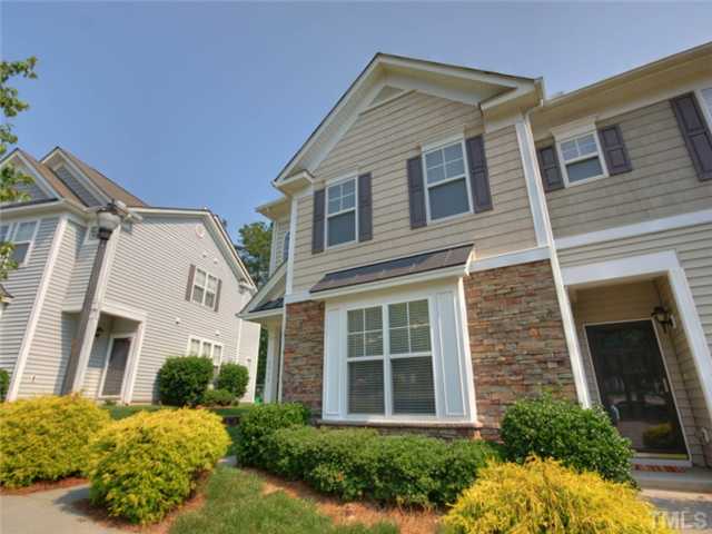 8434 Central Drive Raleigh, NC 27613 - Photo 20 of 25 a front view of a house with a garden