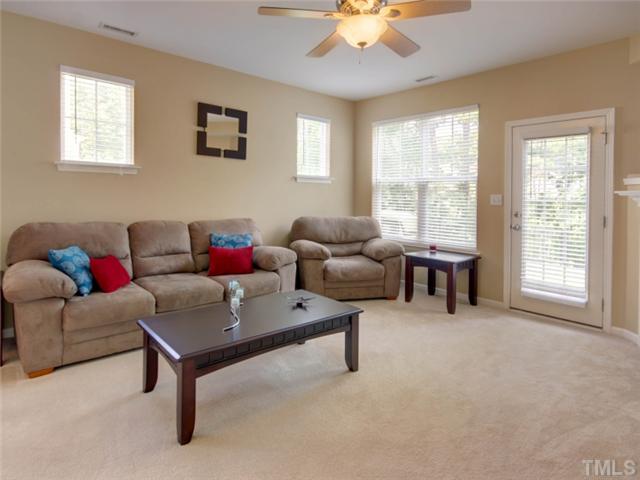 8434 Central Drive Raleigh, NC 27613 - Photo 4 of 25 a living room with furniture and a large window
