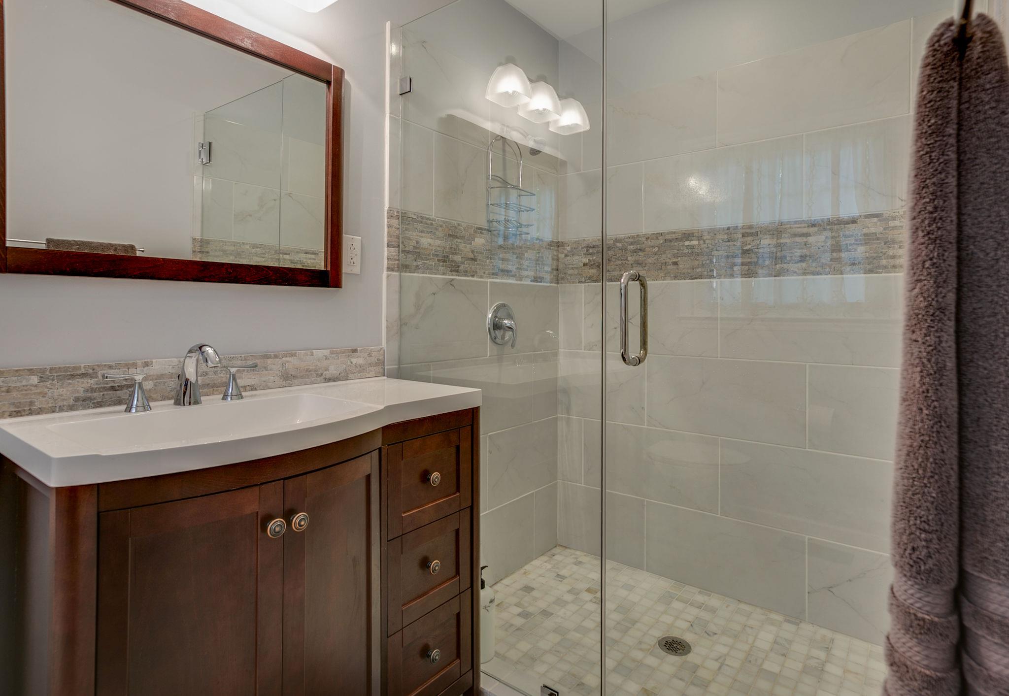 1649 Deerrun Road Murfreesboro, TN 37129 - Photo 12 of 28 a bathroom with a shower sink and mirror