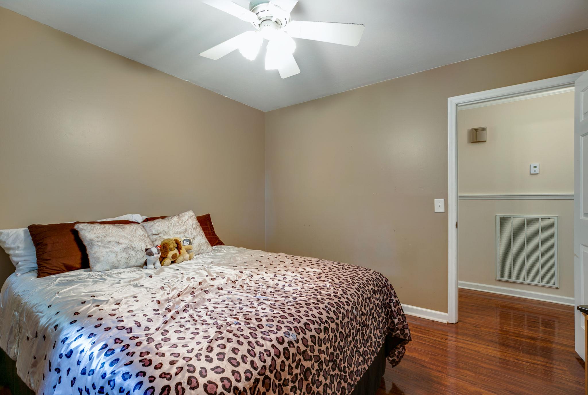 1649 Deerrun Road Murfreesboro, TN 37129 - Photo 15 of 28 a bedroom with a bed and wooden floor
