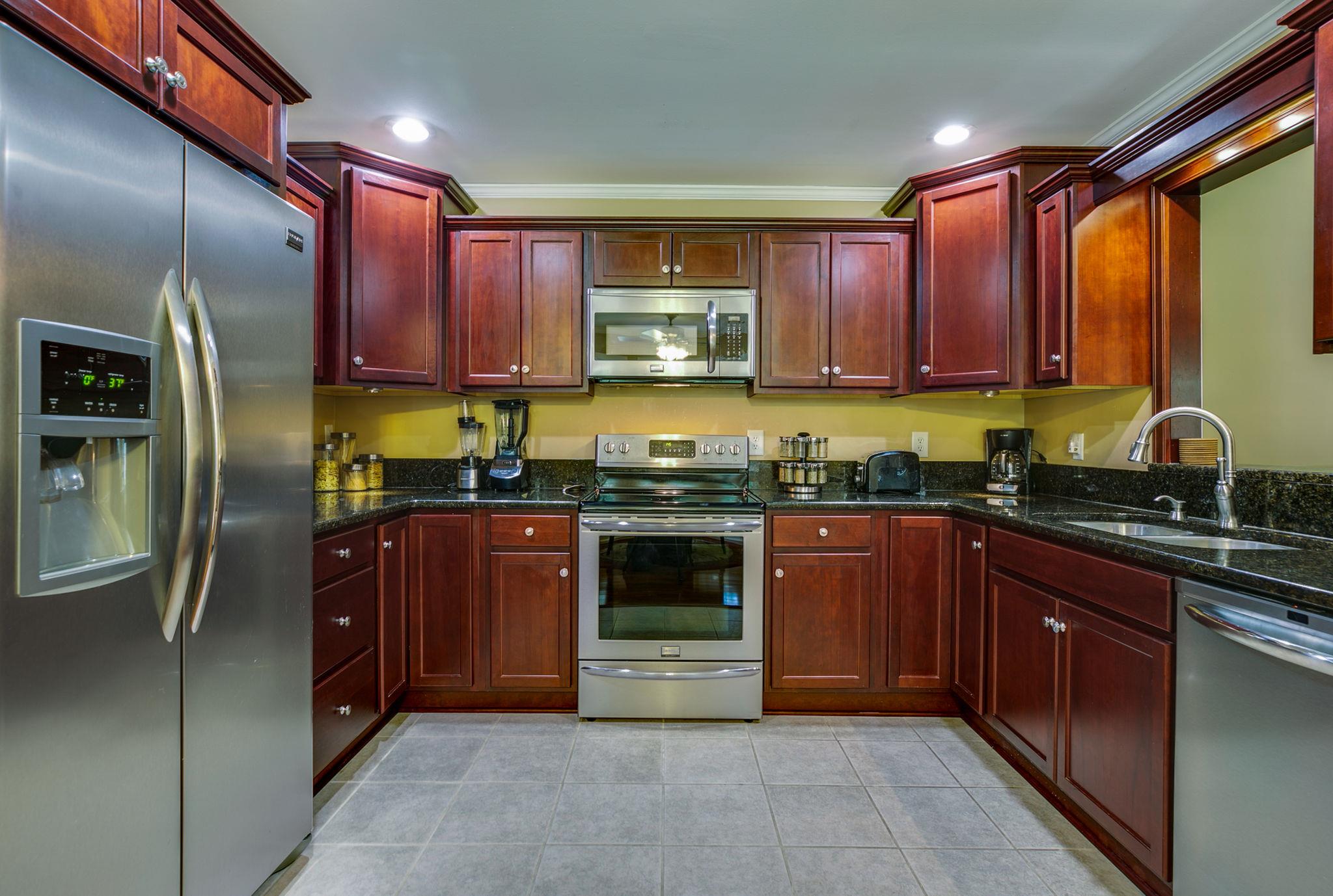 1649 Deerrun Road Murfreesboro, TN 37129 - Photo 20 of 28 a kitchen with stainless steel appliances granite countertop a refrigerator and a sink