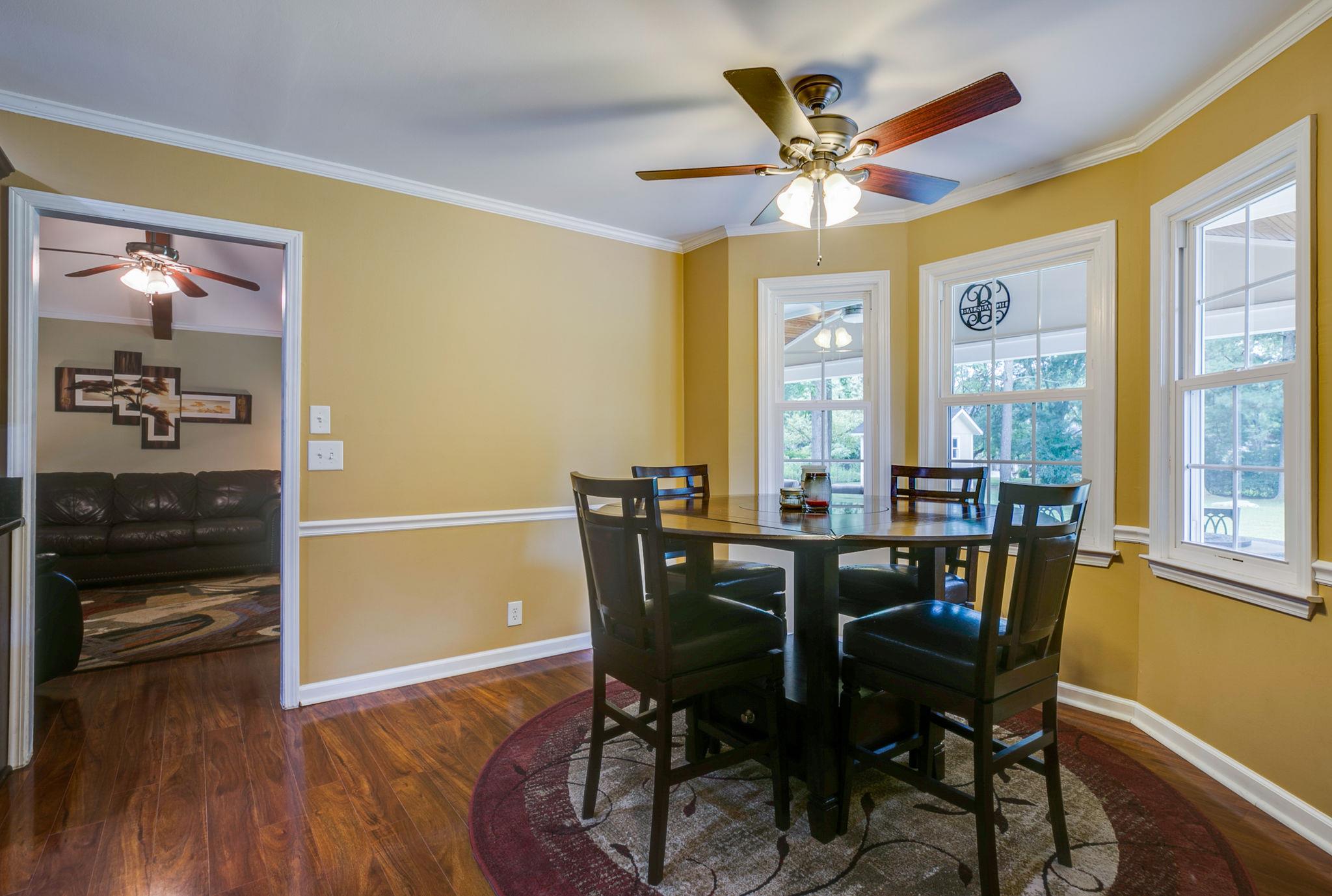 1649 Deerrun Road Murfreesboro, TN 37129 - Photo 22 of 28 a view of a dining room with furniture window and wooden floor