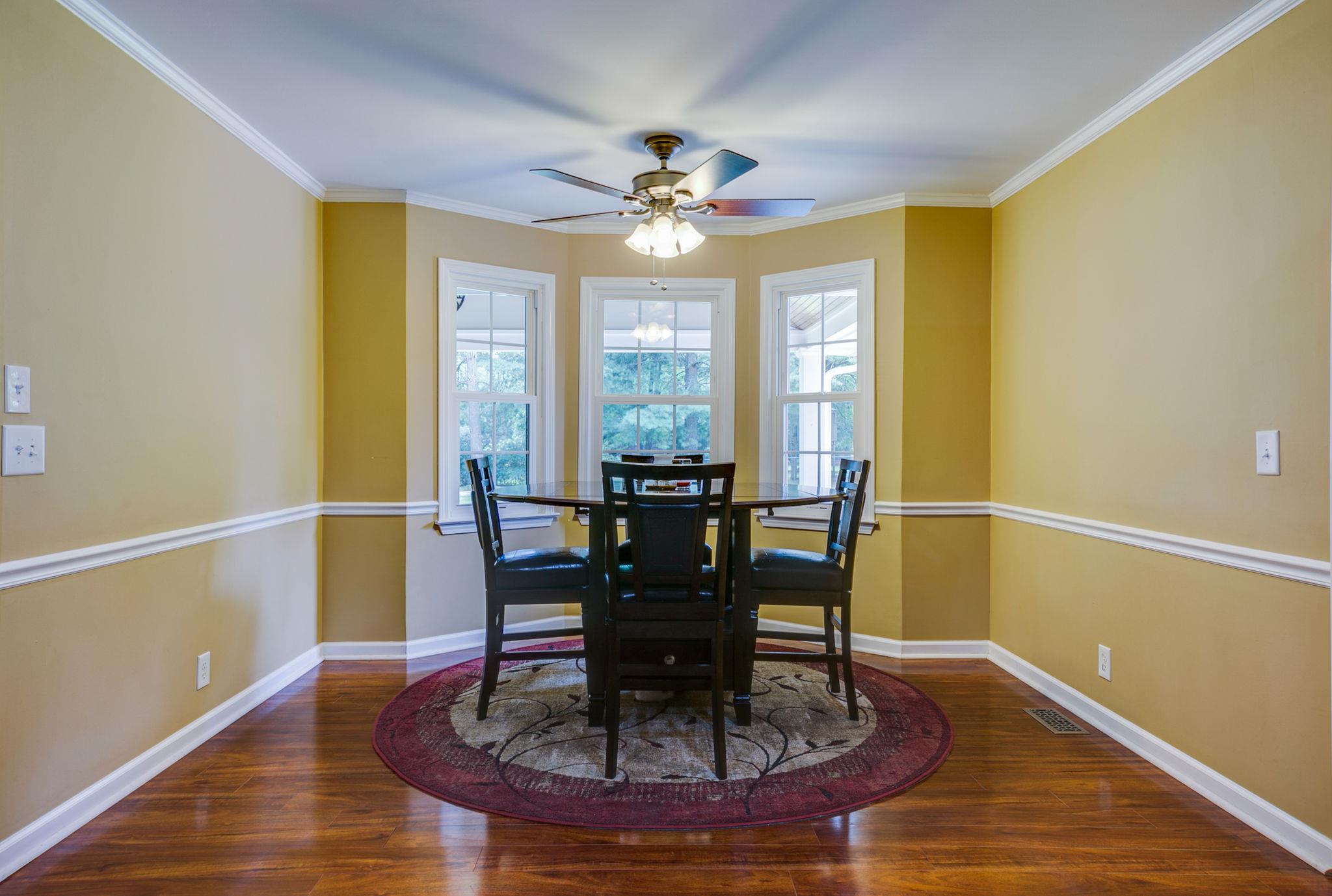 1649 Deerrun Road Murfreesboro, TN 37129 - Photo 23 of 28 a view of a dining room with furniture and wooden floor