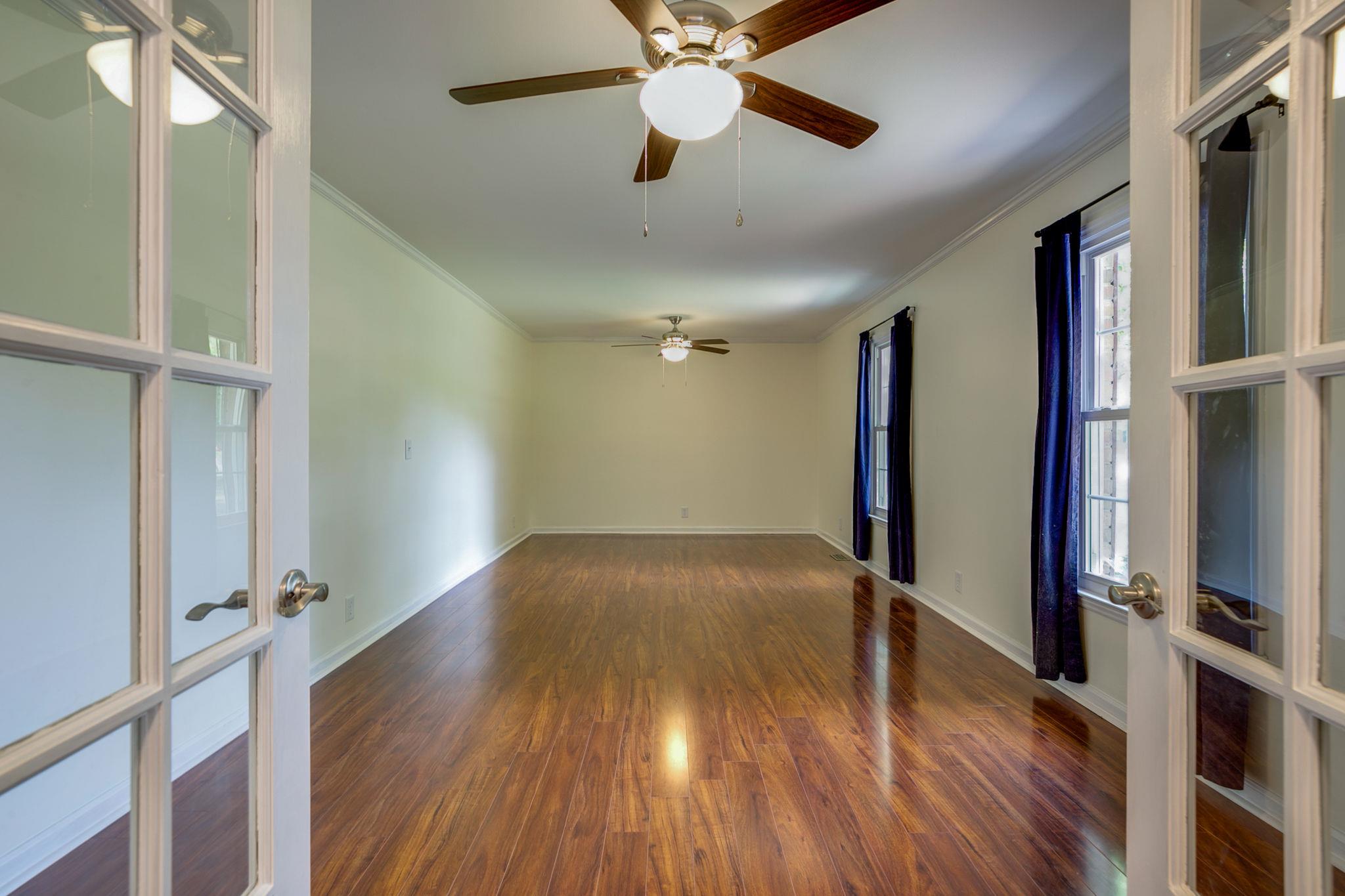 1649 Deerrun Road Murfreesboro, TN 37129 - Photo 6 of 28 a view of empty room with wooden floor and fan