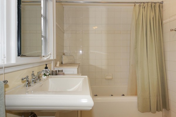 19 Highland Road Belmont, MA 02478 - Photo 16 of 30 a bathroom with a sink and a bathtub