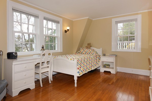 19 Highland Road Belmont, MA 02478 - Photo 18 of 30 a bedroom with a bed and a table in it