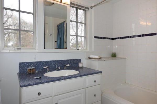 19 Highland Road Belmont, MA 02478 - Photo 20 of 30 a bathroom with a sink and a mirror