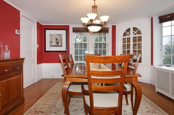 19 Highland Road Belmont, MA 02478 - Photo 8 of 30 a view of a dining room with furniture wooden floor and chandelier
