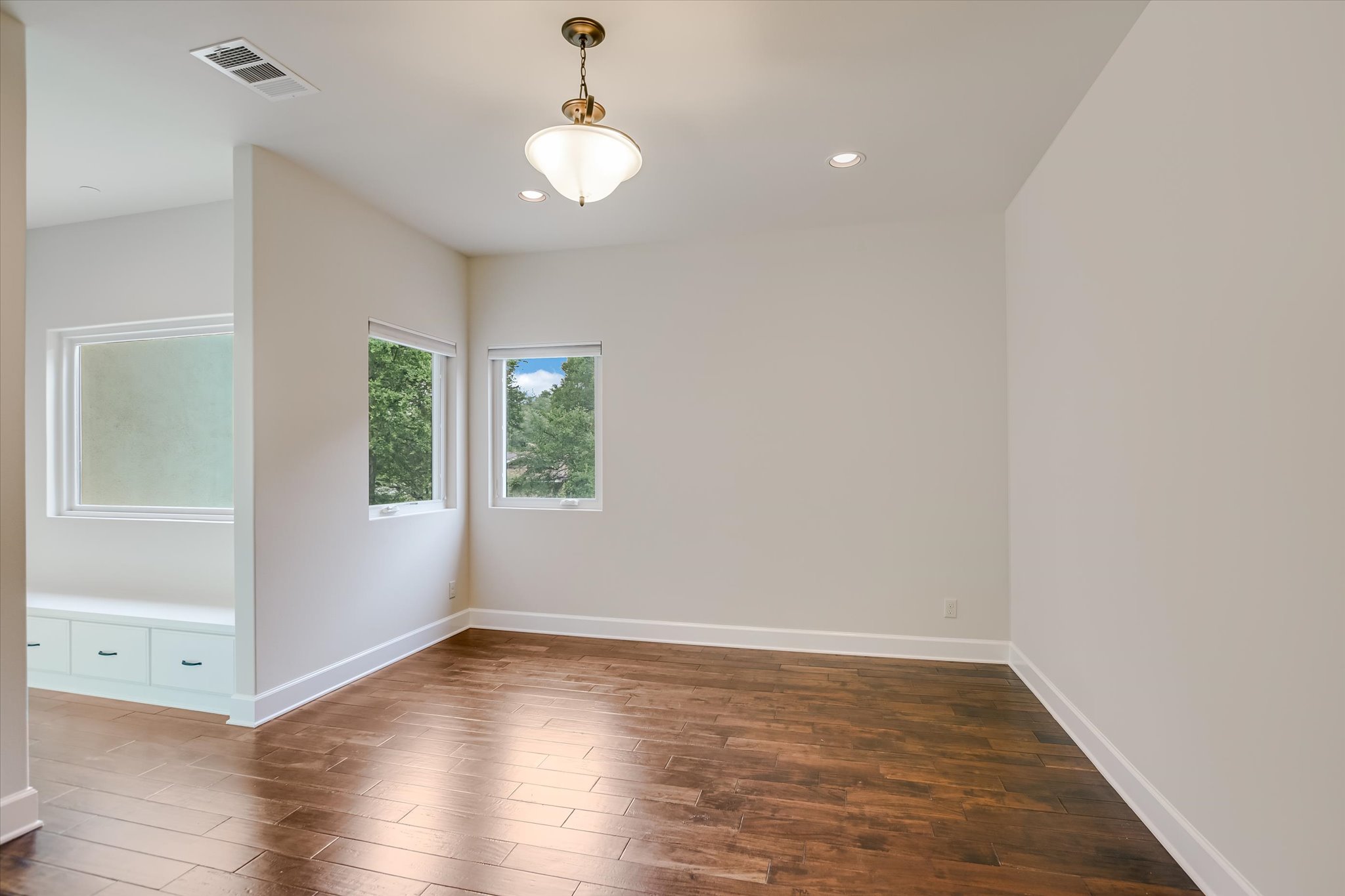 11 Inwood Circle Austin, TX 78746 - Photo 27 of 38 Rich hardwood floors complement bright window views in this adaptable interior space.