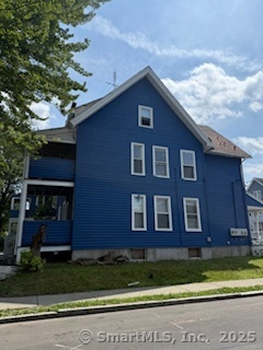 82 South Whitney Street Hartford, CT 06106 - Photo 3 of 7 a front view of a house with a yard