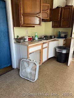 82 South Whitney Street Hartford, CT 06106 - Photo 4 of 7 a kitchen with stainless steel appliances granite countertop a sink a stove and a microwave