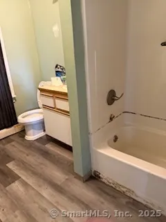 a bathroom with a sink a toilet and bathtub