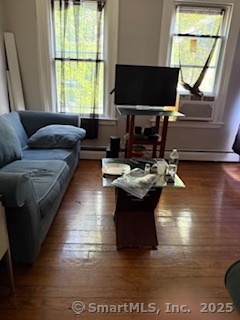 82 South Whitney Street Hartford, CT 06106 - Photo 6 of 7 a living room with fireplace furniture and a flat screen tv