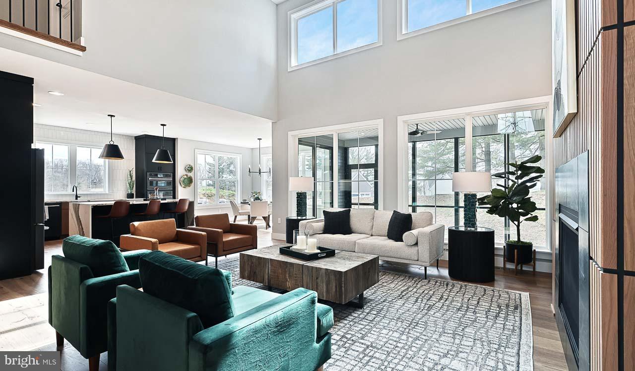 90 Tupelo Street Lititz, PA 17543 - Photo 13 of 38 a living room with furniture fireplace and large windows