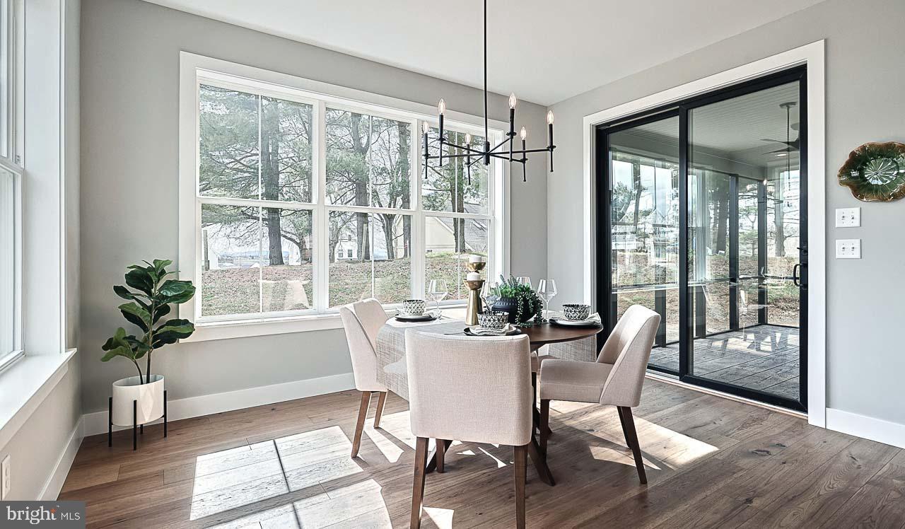 90 Tupelo Street Lititz, PA 17543 - Photo 19 of 38 a view of a dining room with furniture window and wooden floor