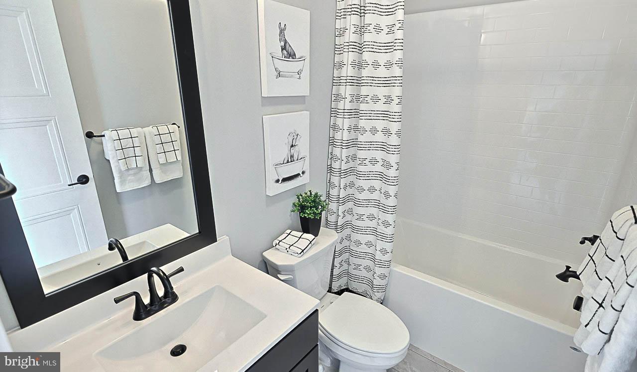 90 Tupelo Street Lititz, PA 17543 - Photo 27 of 38 a bathroom with a sink a toilet a mirror and shower