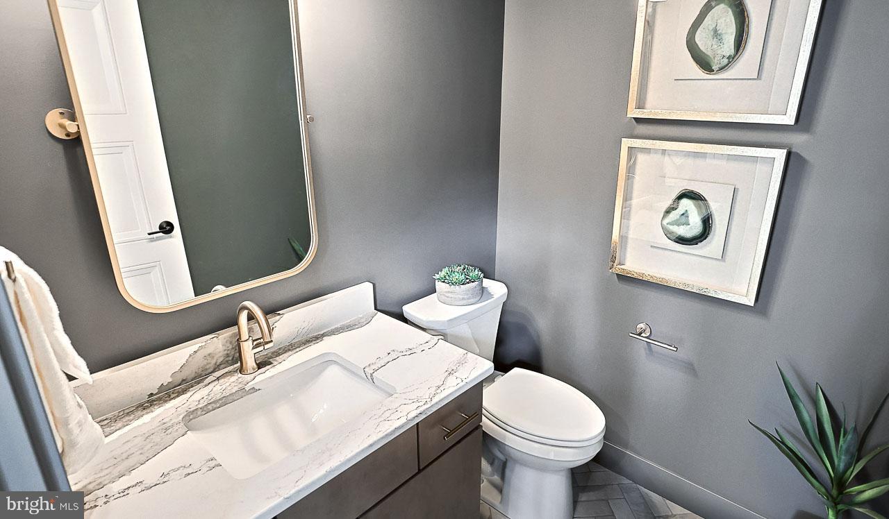 90 Tupelo Street Lititz, PA 17543 - Photo 28 of 38 a white toilet sitting next to a bathroom sink