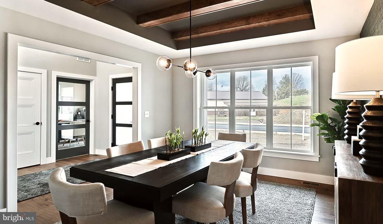 90 Tupelo Street Lititz, PA 17543 - Photo 7 of 38 a dining room with furniture a chandelier and wooden floor