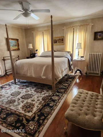 a bedroom with a bed and dresser