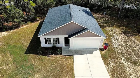 a house view with a garden space