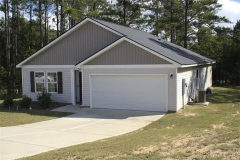a house with trees in the background