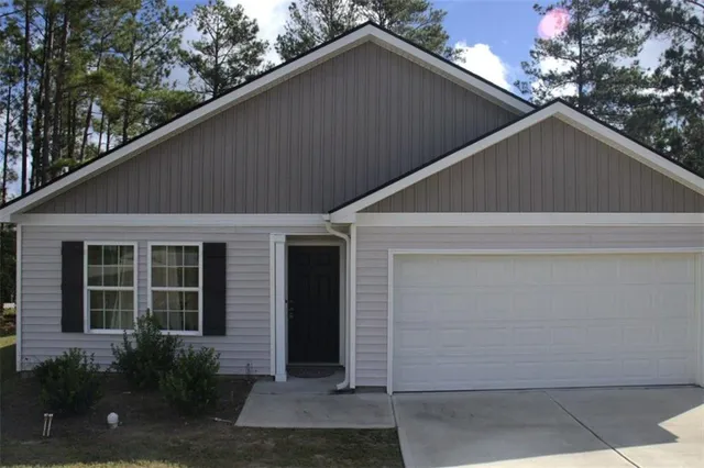a backyard of a house with potted plants