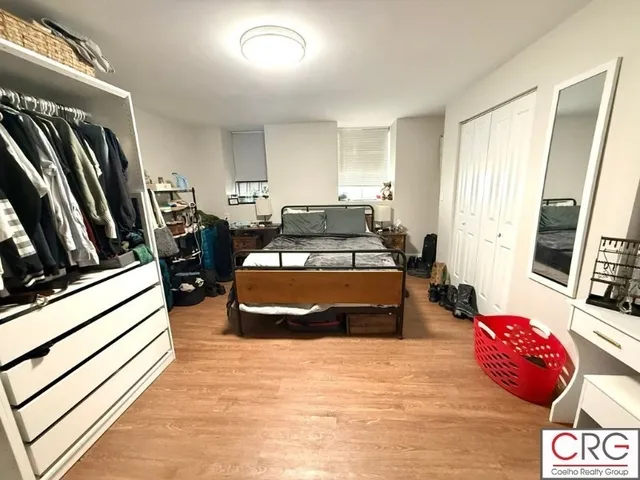 a bedroom with furniture and a window