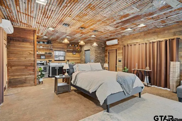 a bed room with a bed and furniture