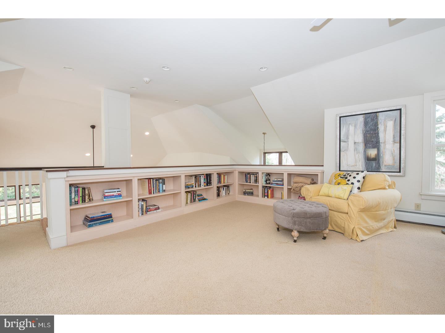 545 Manor Road Wynnewood, PA 19096 - Photo 22 of 25 a living room with furniture and a book shelf