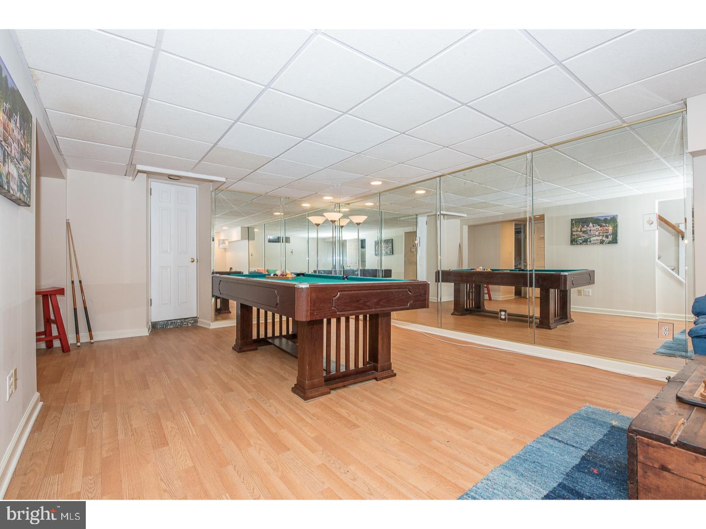545 Manor Road Wynnewood, PA 19096 - Photo 23 of 25 a living room with furniture and a wooden floor