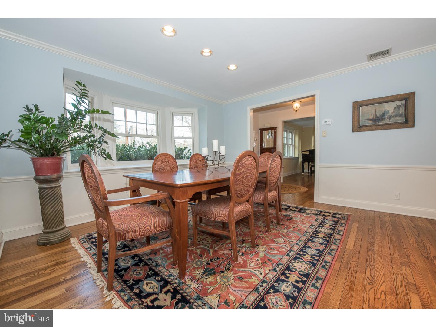 545 Manor Road Wynnewood, PA 19096 - Photo 7 of 25 a dining room with furniture and wooden floor