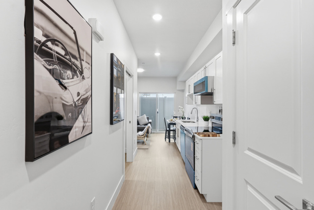 2085 North Main Street, Unit 107 Sunset, UT 84015 - Photo 3 of 21 Hall featuring light wood-type flooring and recessed lighting