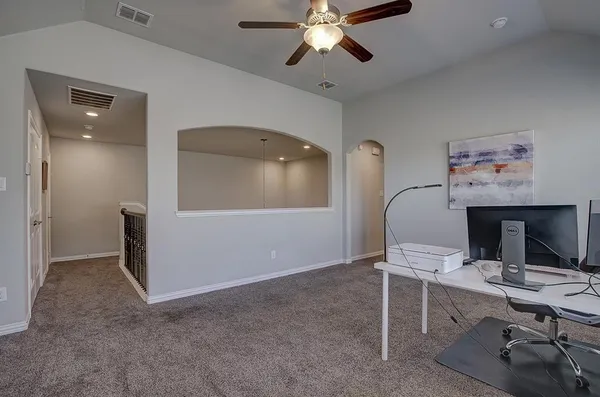 a workspace with furniture and window