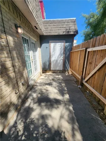 a view of a house with a wooden deck