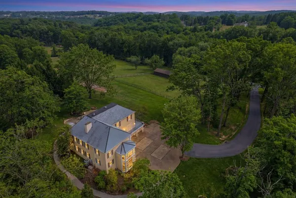an aerial view of a house with mountain view