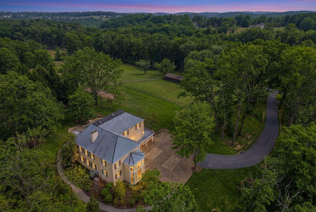 an aerial view of a house with mountain view