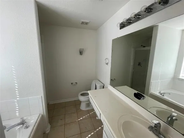 a bathroom with a sink and toilet