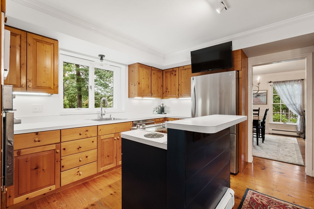 9 Arbor Circle Natick, MA 01760 - Photo 11 of 34 a kitchen with stainless steel appliances granite countertop a sink stove and refrigerator